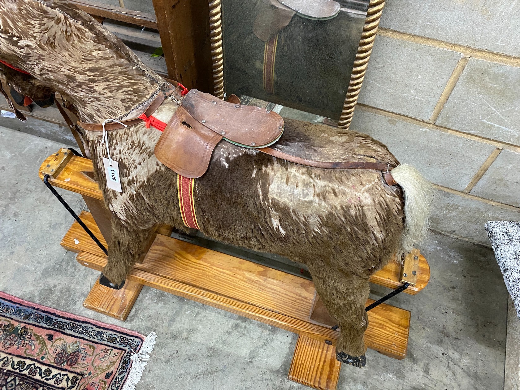 A modern rocking horse on a pine underframe, 112 cm long